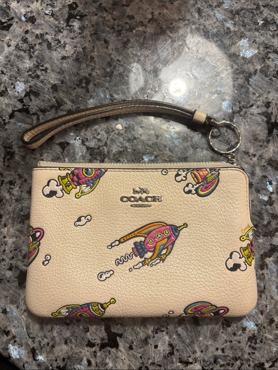 Coach Accessories - Coach Cream Wristlet with Pink, Yellow and Blue Rocket Print